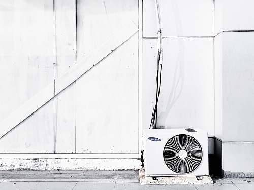 air conditioner grayscale photography of outdoor AC unit appliance